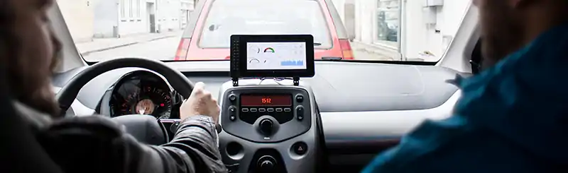 Interior of a car showing the raspberry touch dashboard in the middle of the car's dashboard