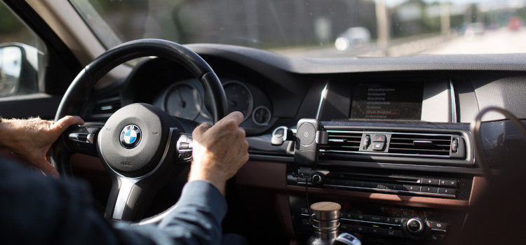 Customer driving a car with insurance