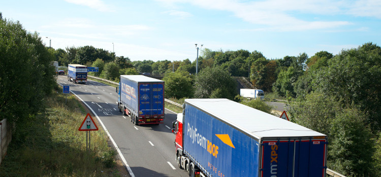 Commercial trucks driving in highway